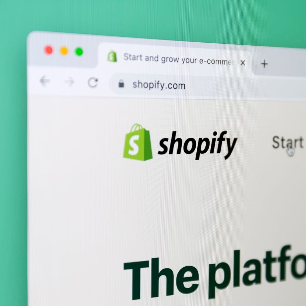 The Shopify homepage open in a web browser, the hosted ecommerce platform
