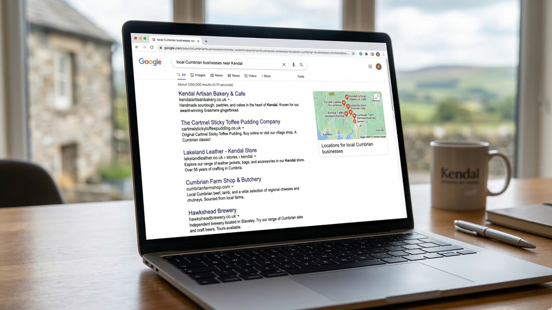A laptop displaying Google search results for local Cumbrian businesses